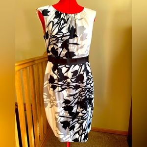 Gorgeous cream colored dress with black and gray flowers.